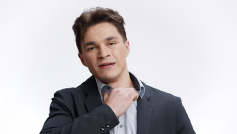 businessman adjusting collar