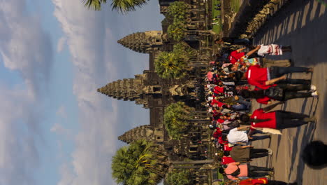 crowds of tourists entering the angkor causeway, time lapse, siem reap, cambodia.
