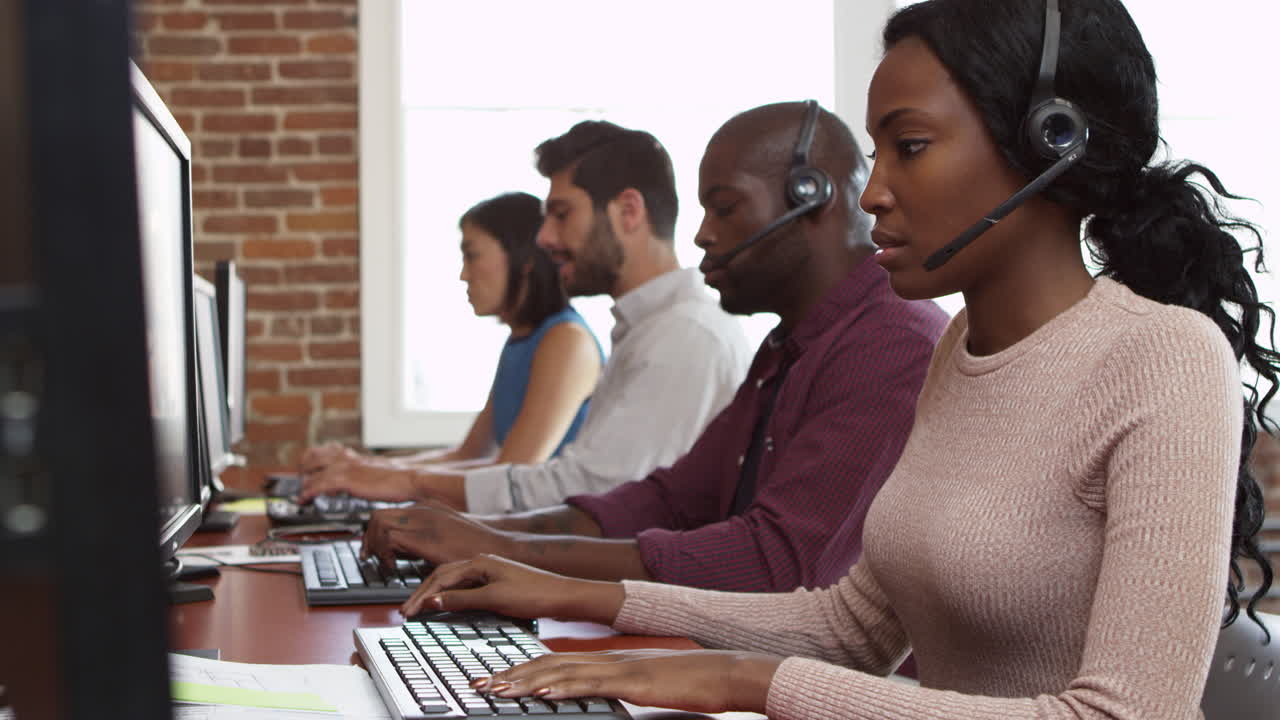 Staff At Desks In Customer Service Department Shot On R3D