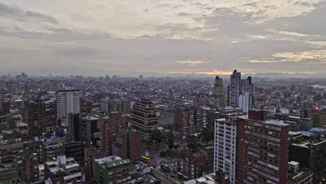 bogota colombia aerial v16 cinematic low level drone flyover chapinero, la salle and teusaquillo neighborhoods capturing urban cityscape at dusk sunset - shot with mavic 3 cine - november 2022