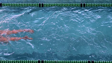 Fit-female-swimmer-doing-the-breast-stroke-in-the-swimming-pool