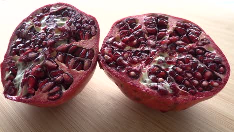 rotating pomegranate fruit and seeds, top view, 4k