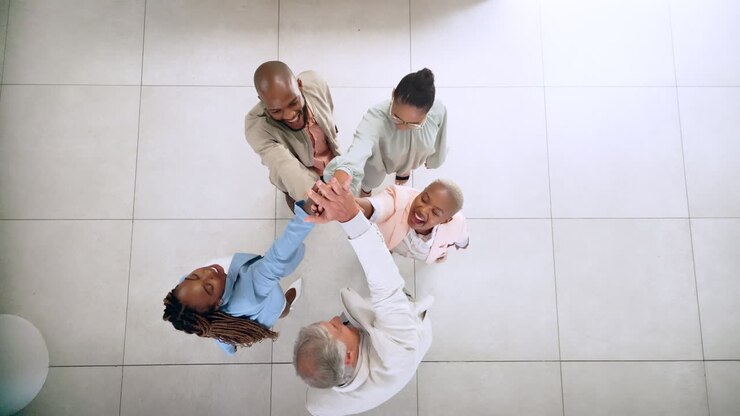 Teamwork, business people and group high five