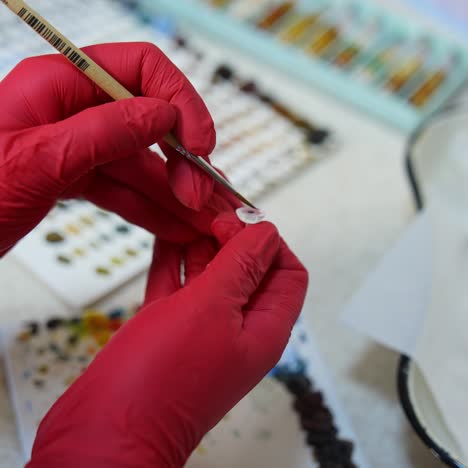 artificial plastic human eye in doctor's hands. eyes transplantation. eye prosthesis. closeup