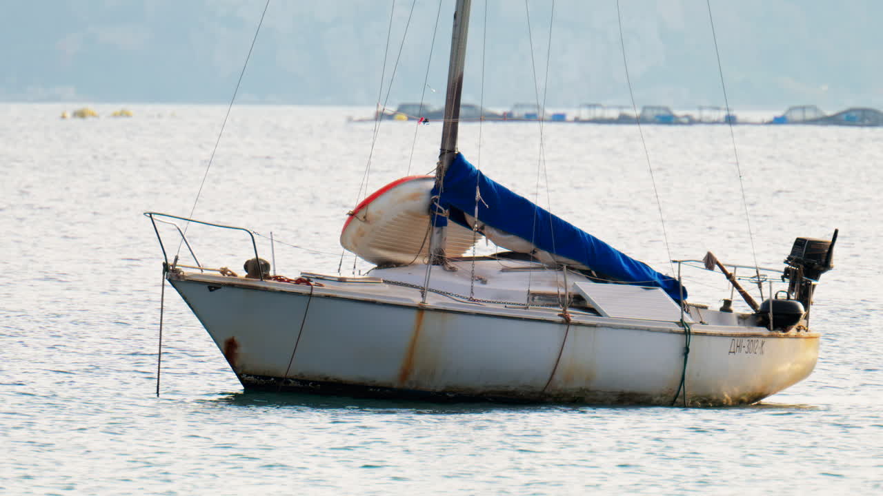 White boat docked on the sea on a cloudy day in Antibes, France