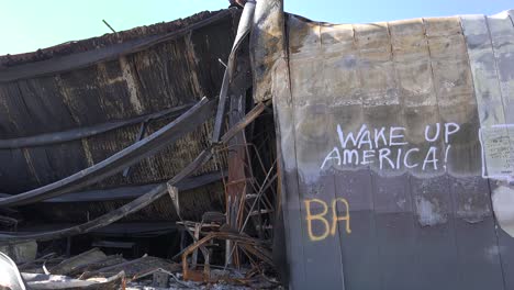 graffiti messages left on the burned out rubble of ferguson missouri urge america to wake up