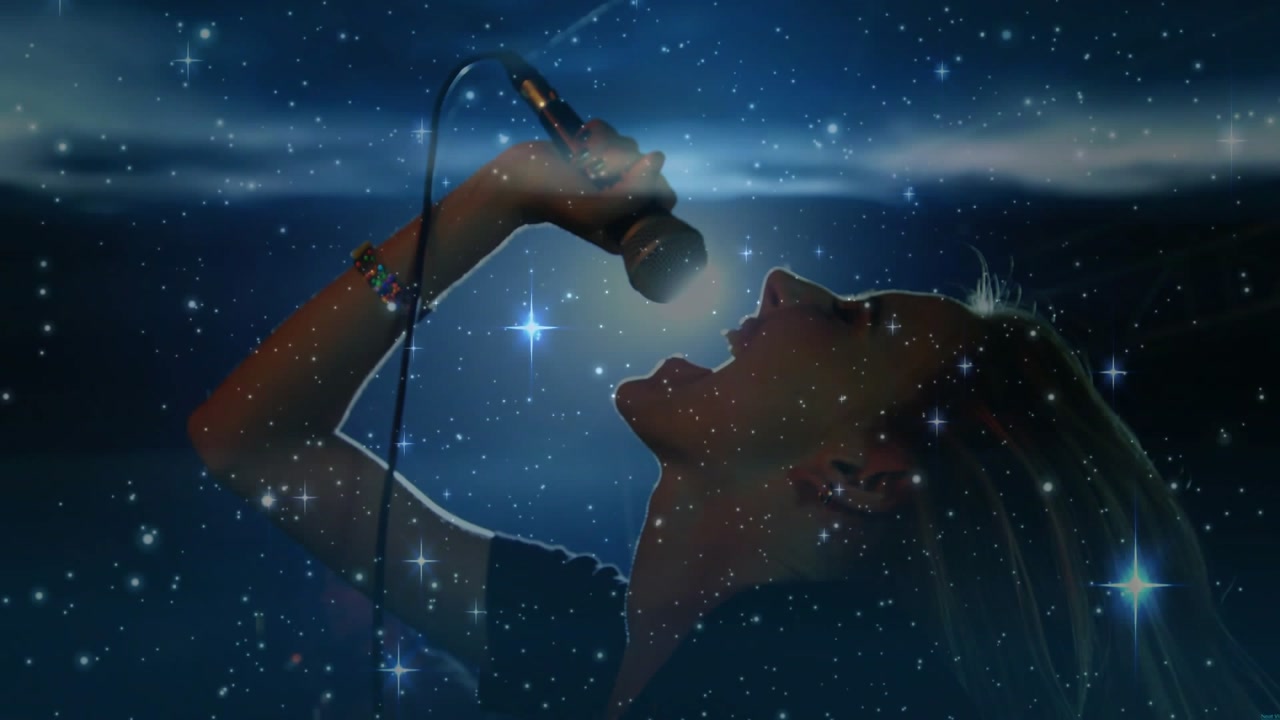 Music woman singer bowing and starting phrase, raising mic into starfield haze, hitting high note
