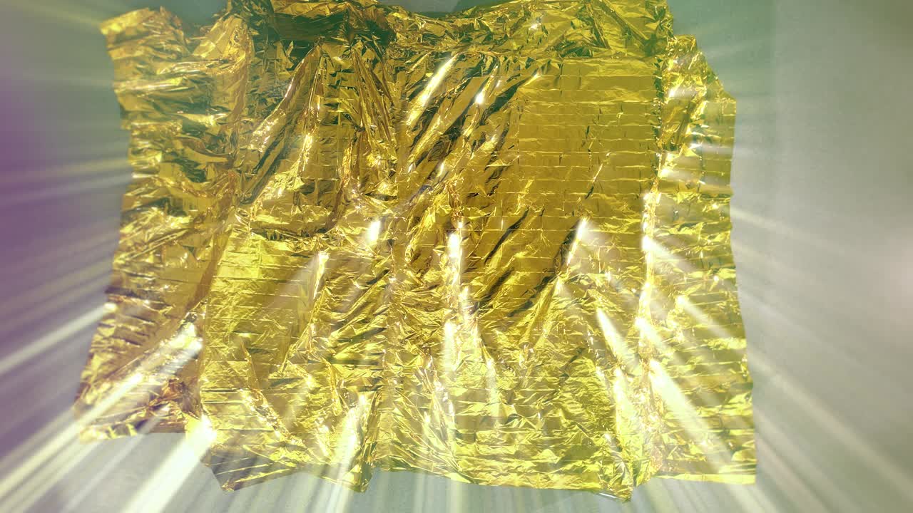 Young dancer with black costume falling on mat with a gold cover