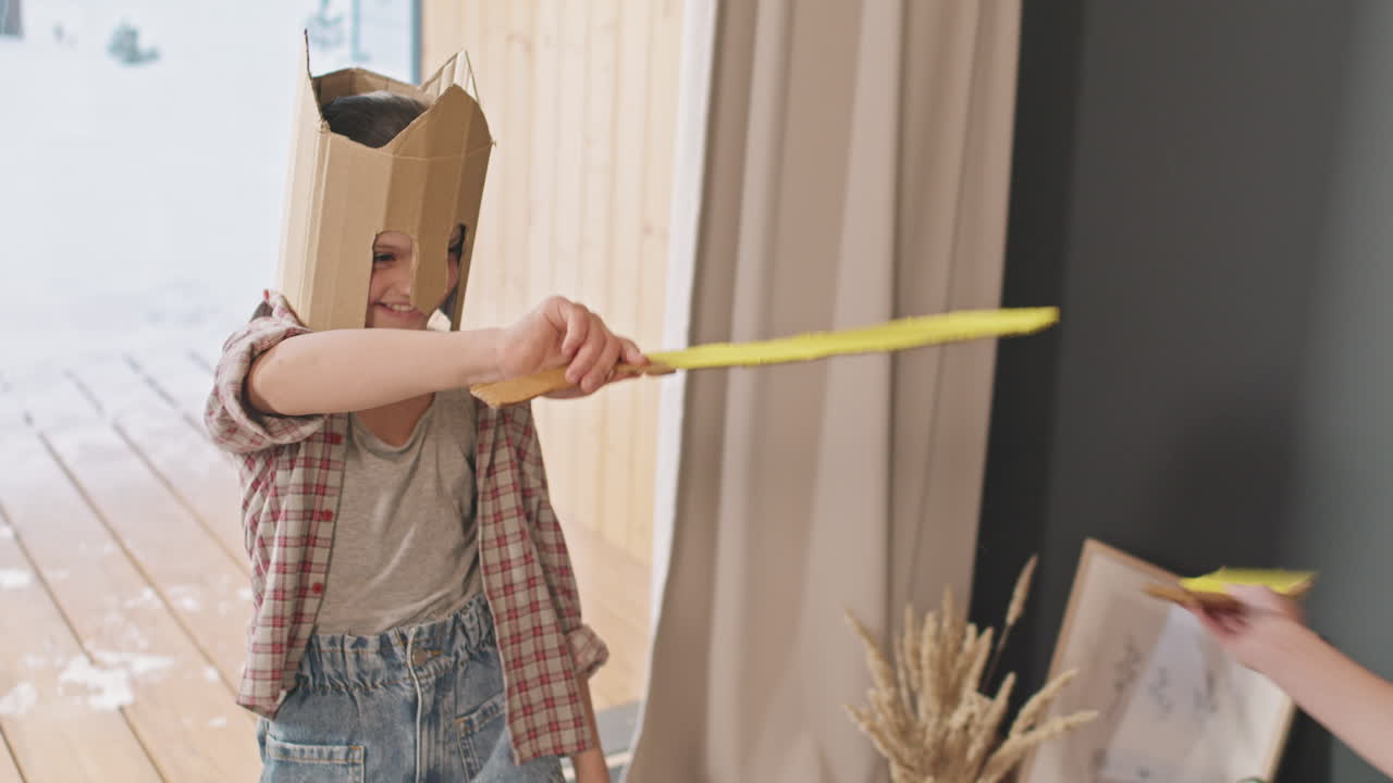 Little Girl Fighting With Toy Swords With Brother
