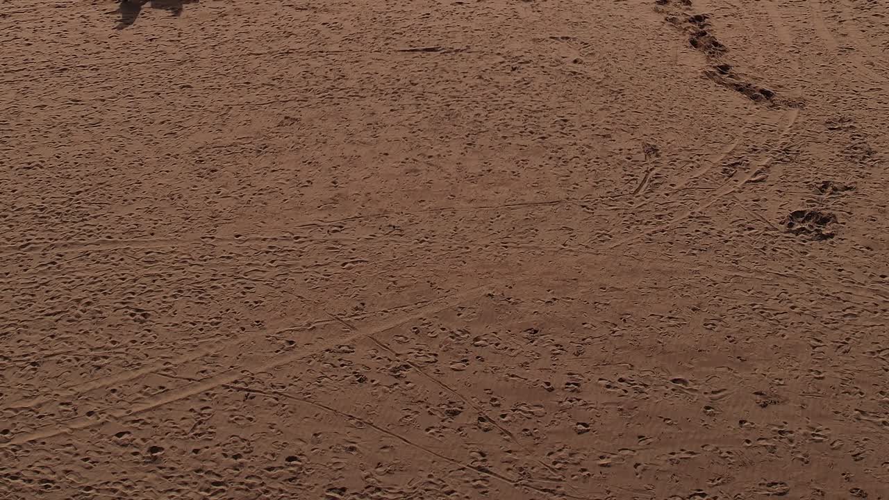View of sandy landscape in Morocco with varied textures and marks