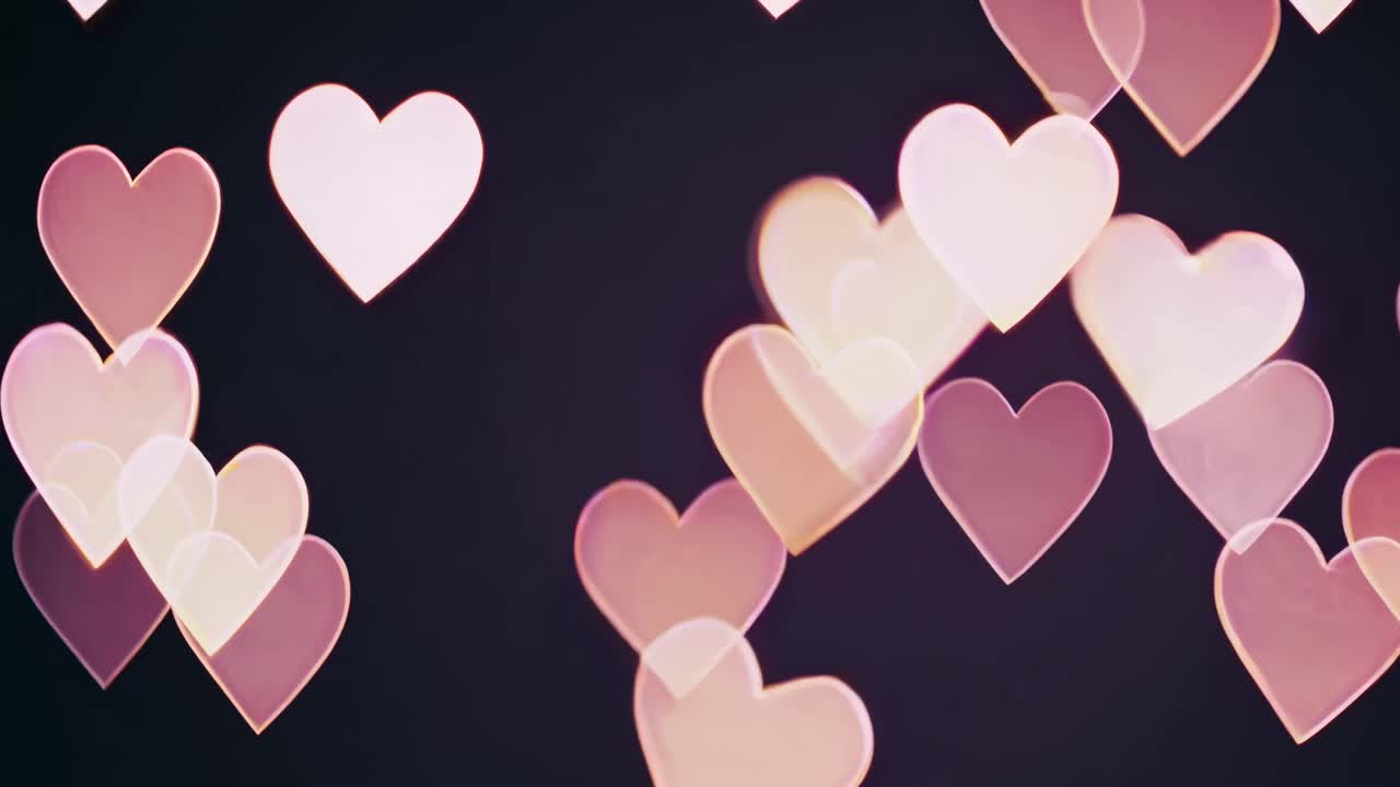 Romantic video concept with soft-focus heart shapes in pink and white