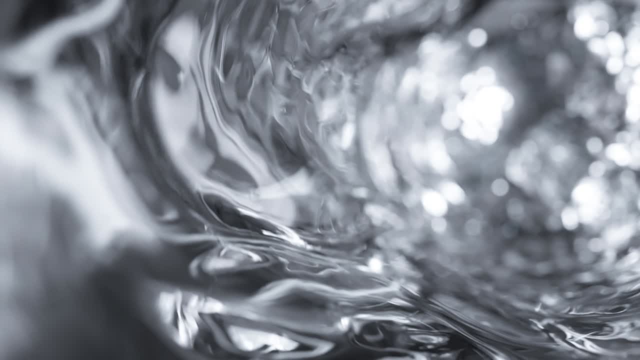 L'acqua si muove in un bicchiere al rallentatore. Sfondo astratto dell'acqua. Render 3D in loop continuo.