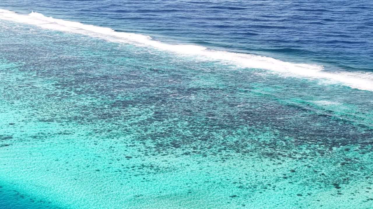 French Polynesia. Aerial View of Coral Reefs Barrier Between Lagoon and South Pacific Ocean
