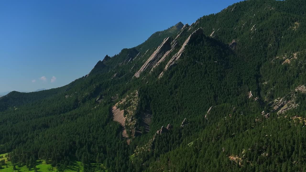 University city town of Boulder Colorado Pearl Street Mall Flatirons slanted Rocky Mountains aerial drone Chautauqua Park Boulder Creek Canyon Mountain Park hiking trail summer blue sky circle right