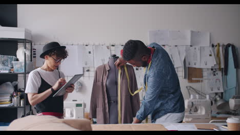 fashion designers working together in a studio