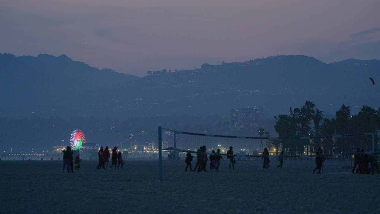 Telephoto shot of famous Santa Monica Pier from Venice Beach, California.