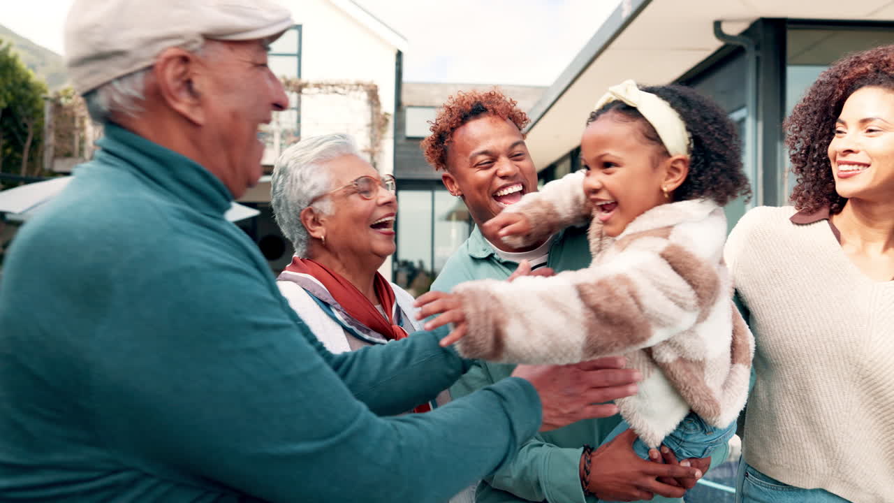 Happy Multi-Generational Family Laughing and Hugging Outdoors