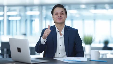 Happy-Indian-businessman-doing-Thumbs-up