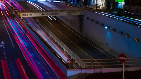 a night timelapse of the traffic jam at the city street in tokyo long shot