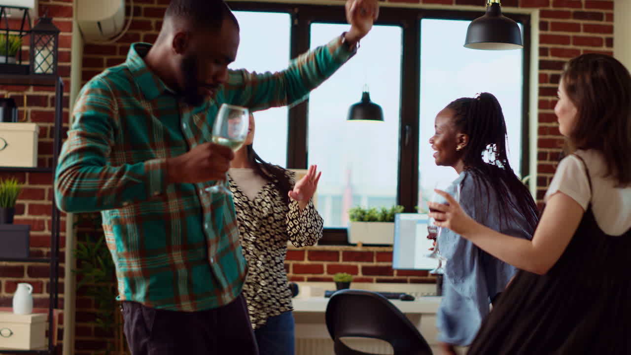 Mates doing energetic dance moves on animated songs in stylish living room during weekend