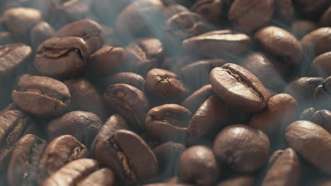 aroma of roasted coffee beans filling the morning air, slide over smoking grains, macro and slow motion