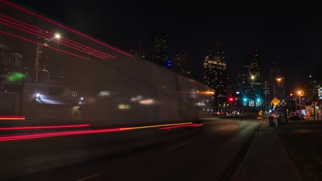 Time-lapse-of-cars-at-night-in-Houston-wit-downtown-in-the-foreground