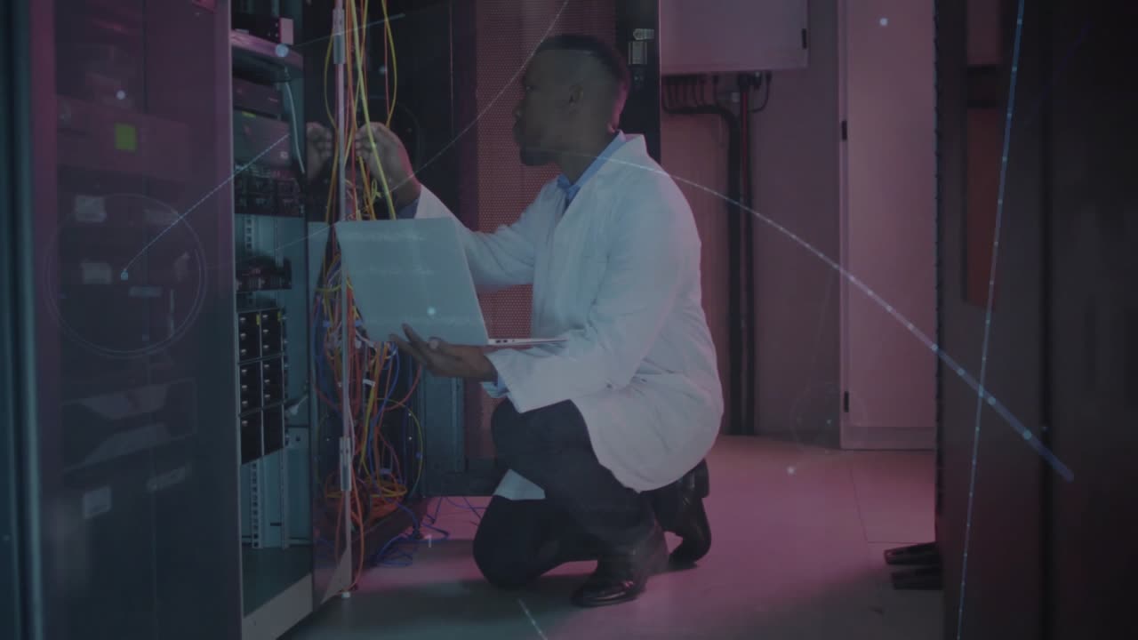 Network engineer reviewing logs then plugging yellow cable with data overlay showing network uptime