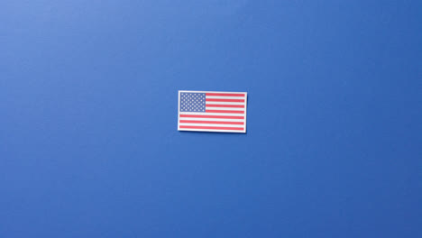 national flag of usa lying on blue background with copy space