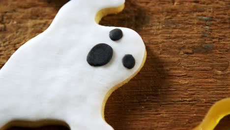 gingerbread cookie and other sweet foods on a wooden table 4k