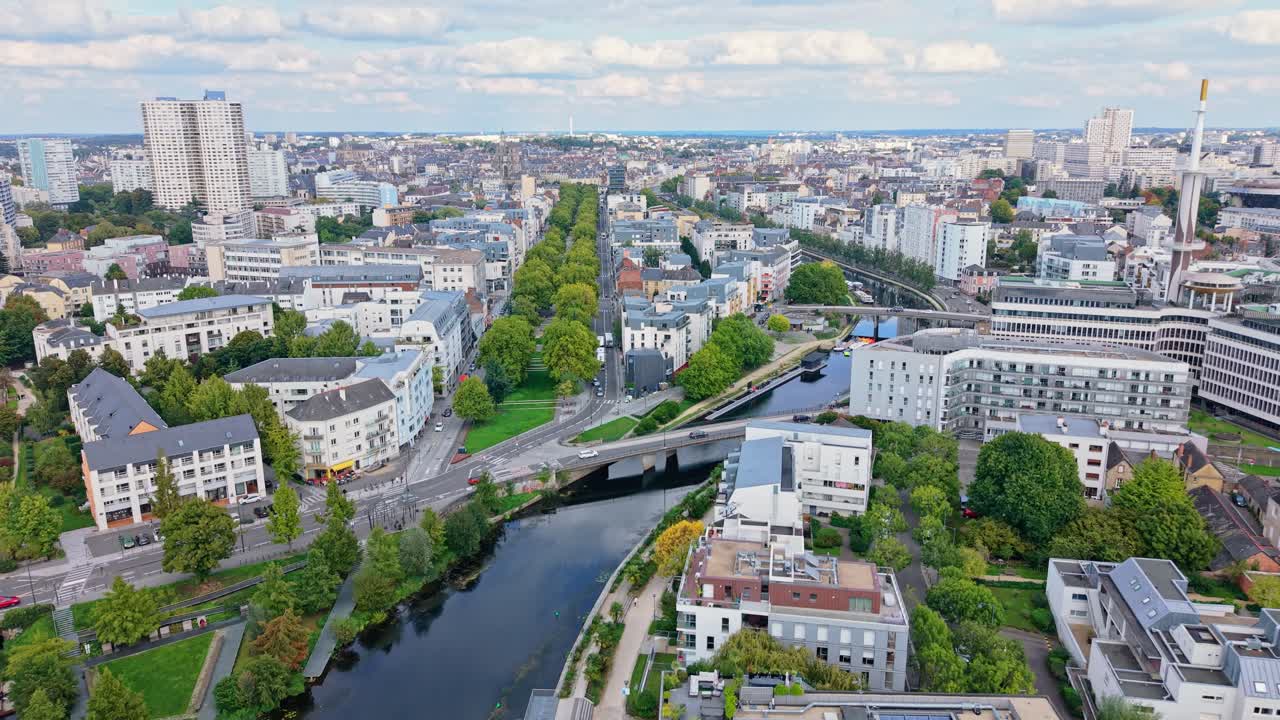 Rennes, Mail Francois Mitterrand, Vilaine river, and city skyline with Tour des Horizons, France. Aerial drone backward