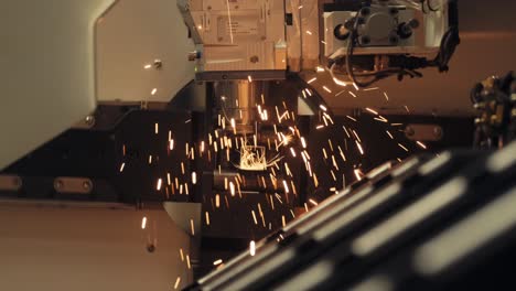 automatic cnc laser cut machine while cutting the metal part with the sparking light