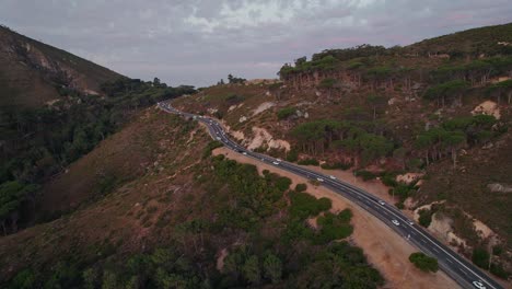 Vehicles-Driving-On-Camps-Bay-Drive-To-City-Centre-In-Cape-Town,-South-Africa