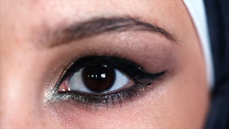 close-up of a woman's eye with makeup and hijab
