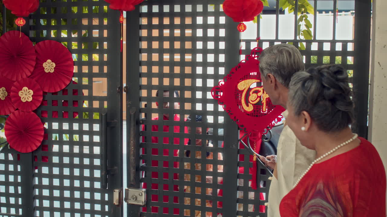 Multi-generational Family Meeting Outdoors for Tet Celebration