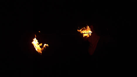 Fire-dancer-spinning-fire-in-the-dark
