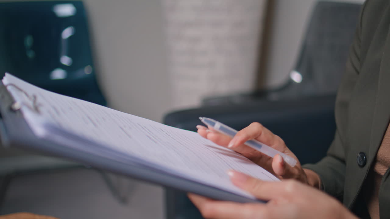 Woman hands holding insurance healthcare clinic closeup. Lady reading agreement