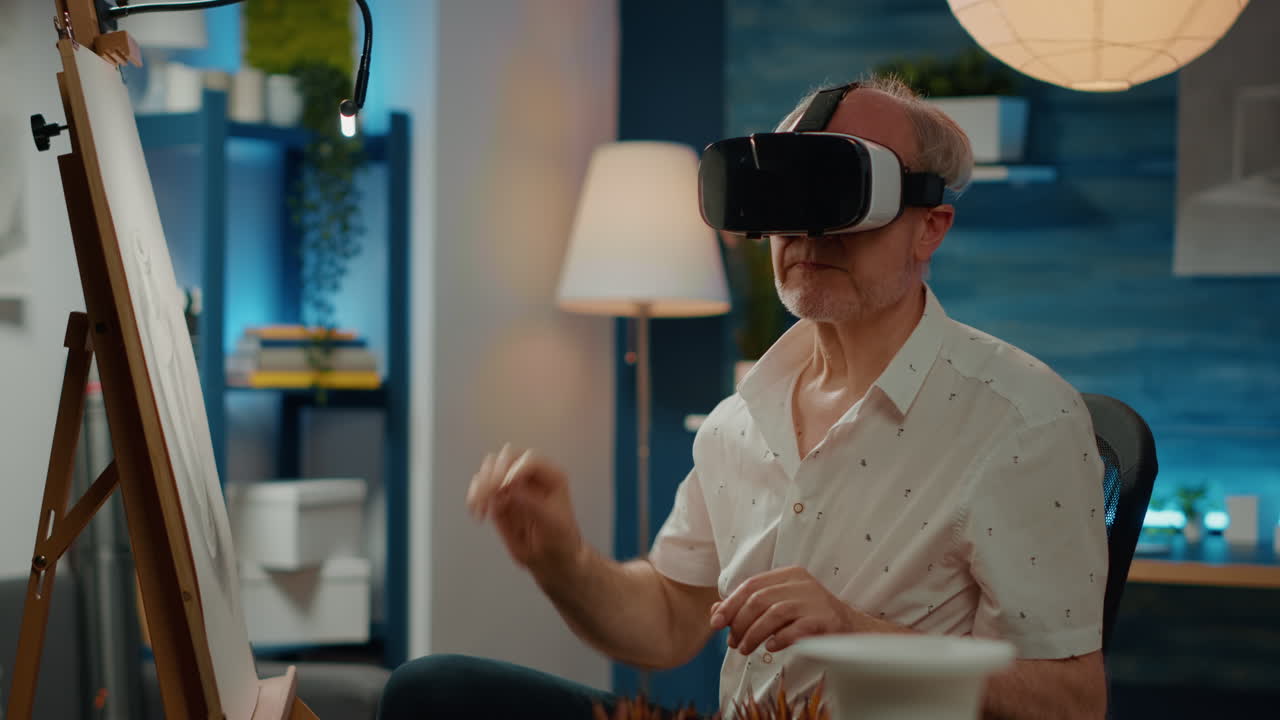 Senior man with creative skills drawing artwork using vr glasses