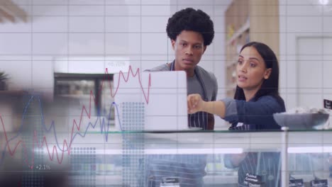 Animation-of-data-processing-over-diverse-waiter-and-waitress-discussing-over-a-laptop-at-a-cafe