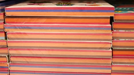 a stack of colorful books