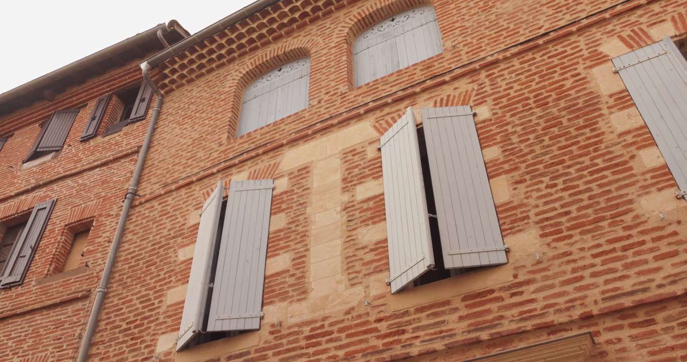 Take a journey through Albi, France, showcasing the stunning red brick buildings of the old town.