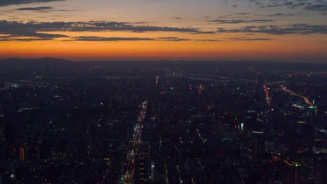 Wide-open-panorama-view-over-Taipei-at-sunset-with-city-lights