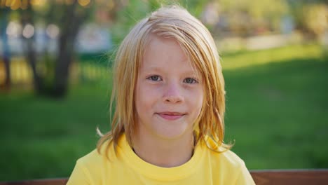 young boy in a yellow shirt