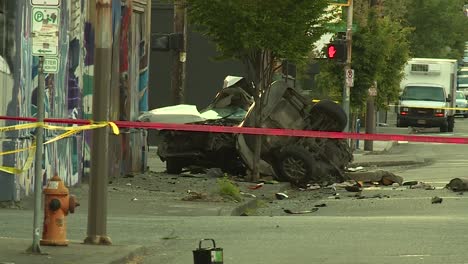 car crash torn in half across street