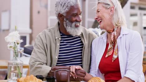 senior couple enjoying breakfast at a cafe
