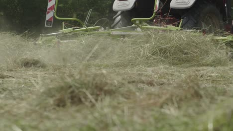 Farm-Machine-Tractor-With-Rotating-Rake-Attachments