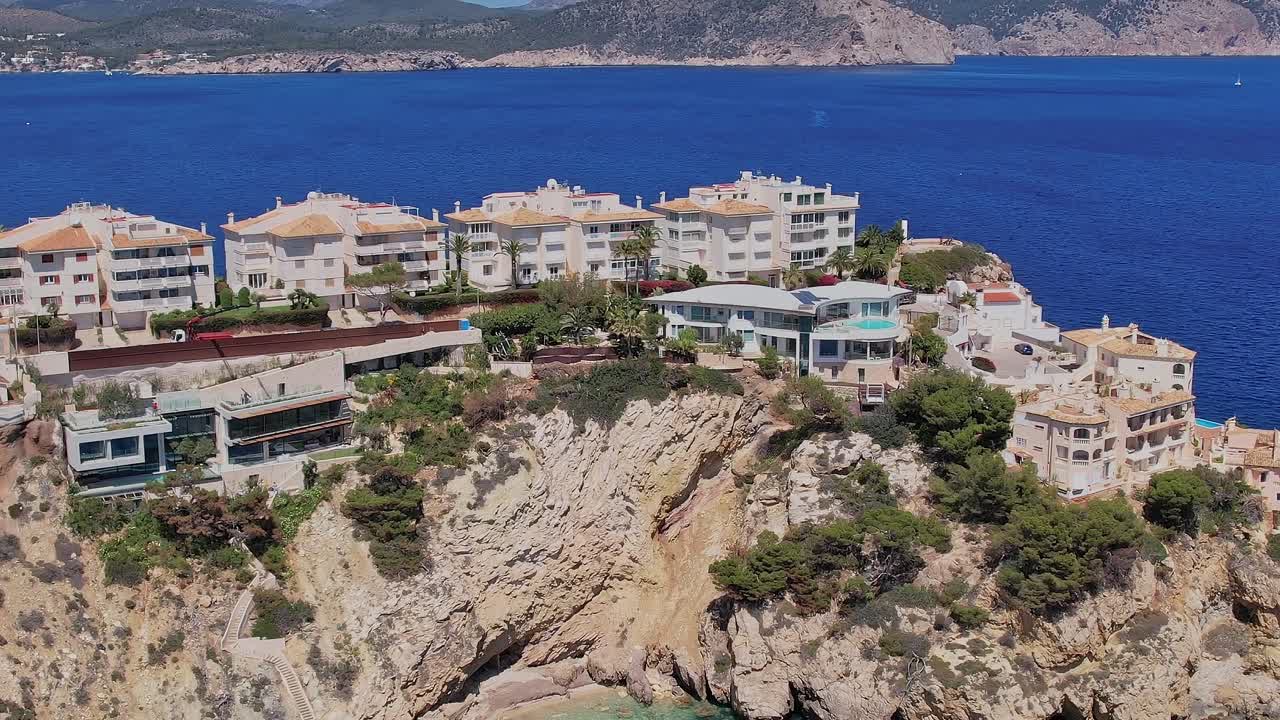 View of coastal homes and cliffs in Mallorca Spain from above