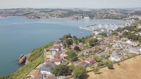 aerial crane up, revealing small town and houses