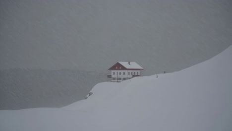 snowy mountain cabin in a blizzard