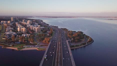 aerial view from above the narrows bridge showing busy morning commute in perth, western australia with forward camera motion