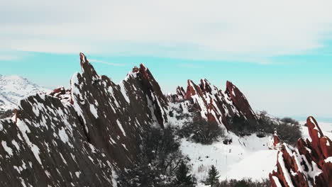 after snow spring blizzard roxborogh state park golf course aerial drone colorado front range winter spring deep powder dramatic sharp pointy red rocks mountain landscape littleton denver upward jib